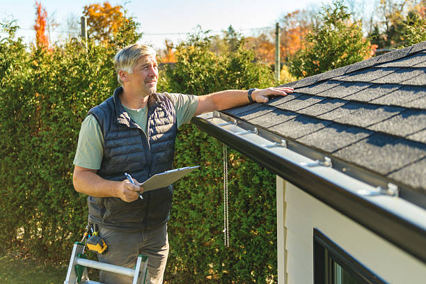 Professional Hail Damage Roof Repair technician working in Rockville, RI
